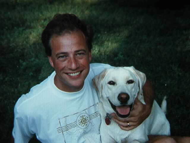 Carl with Holly the yellow Lab — from the original Four Seasons Firearms website